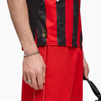 AC Milan 2025/26 Home soccer jersey - hem detail on model