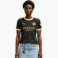 Manchester City 2026/27 away women's jersey — front on female model; AI-assisted background and framing edit