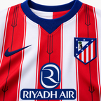 Atlético Madrid 2026/27 Home Kids Kit - collar and chest detail; AI-assisted studio visualization based on the supplier-verified kit