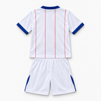 Chelsea 2026/27 Third Kids Kit - shirt and shorts back; AI-assisted studio visualization based on the supplier-verified kit