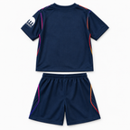 Tottenham Hotspur 2026/27 Away Kids Kit - shirt and shorts back; AI-assisted studio visualization based on the supplier-verified kit