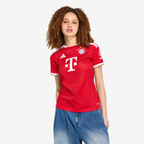 Bayern Munich 2026/27 Home Women's Jersey - woman wearing the shirt; AI-assisted studio background adaptation