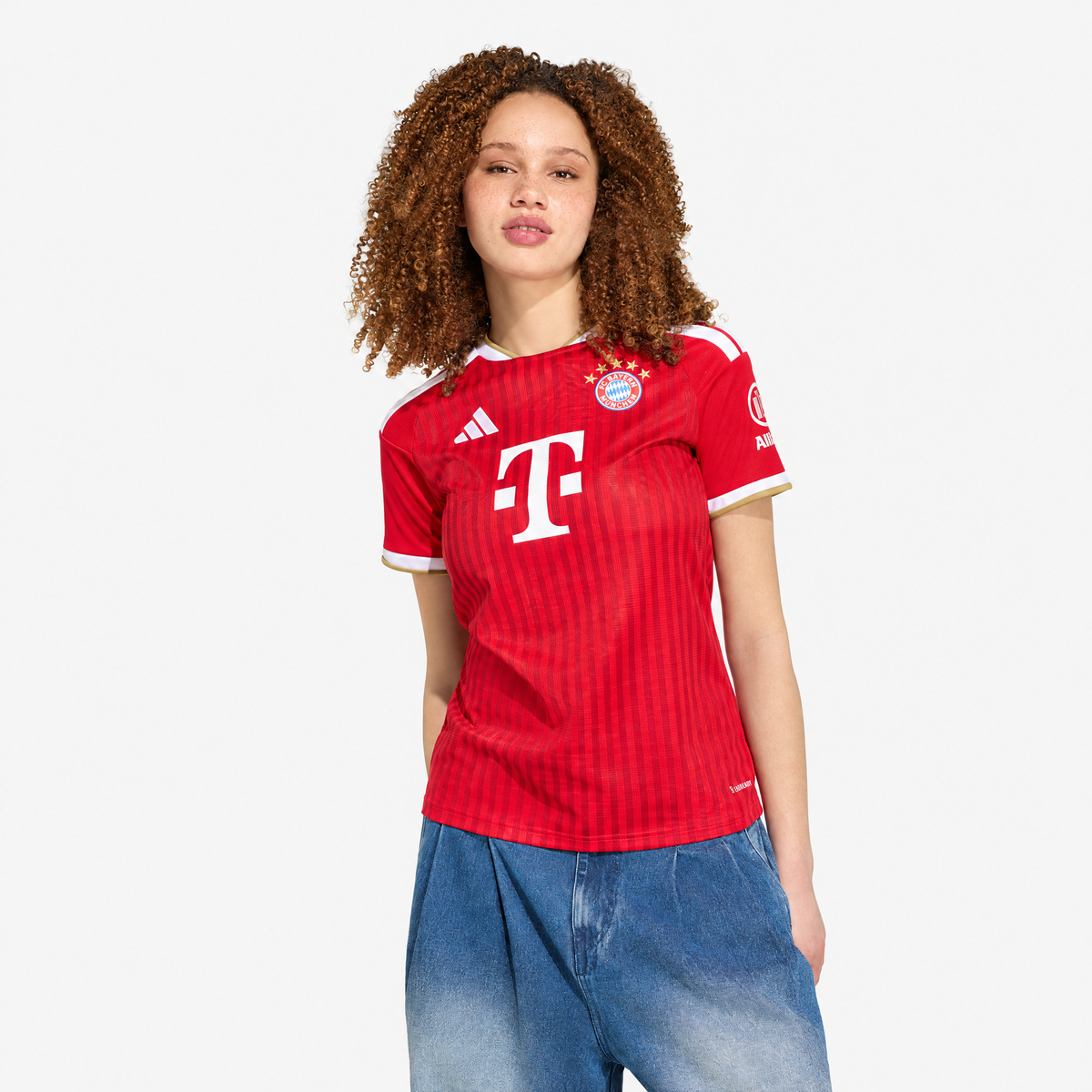 Bayern Munich 2026/27 Home Women's Jersey - woman wearing the shirt; AI-assisted studio background adaptation
