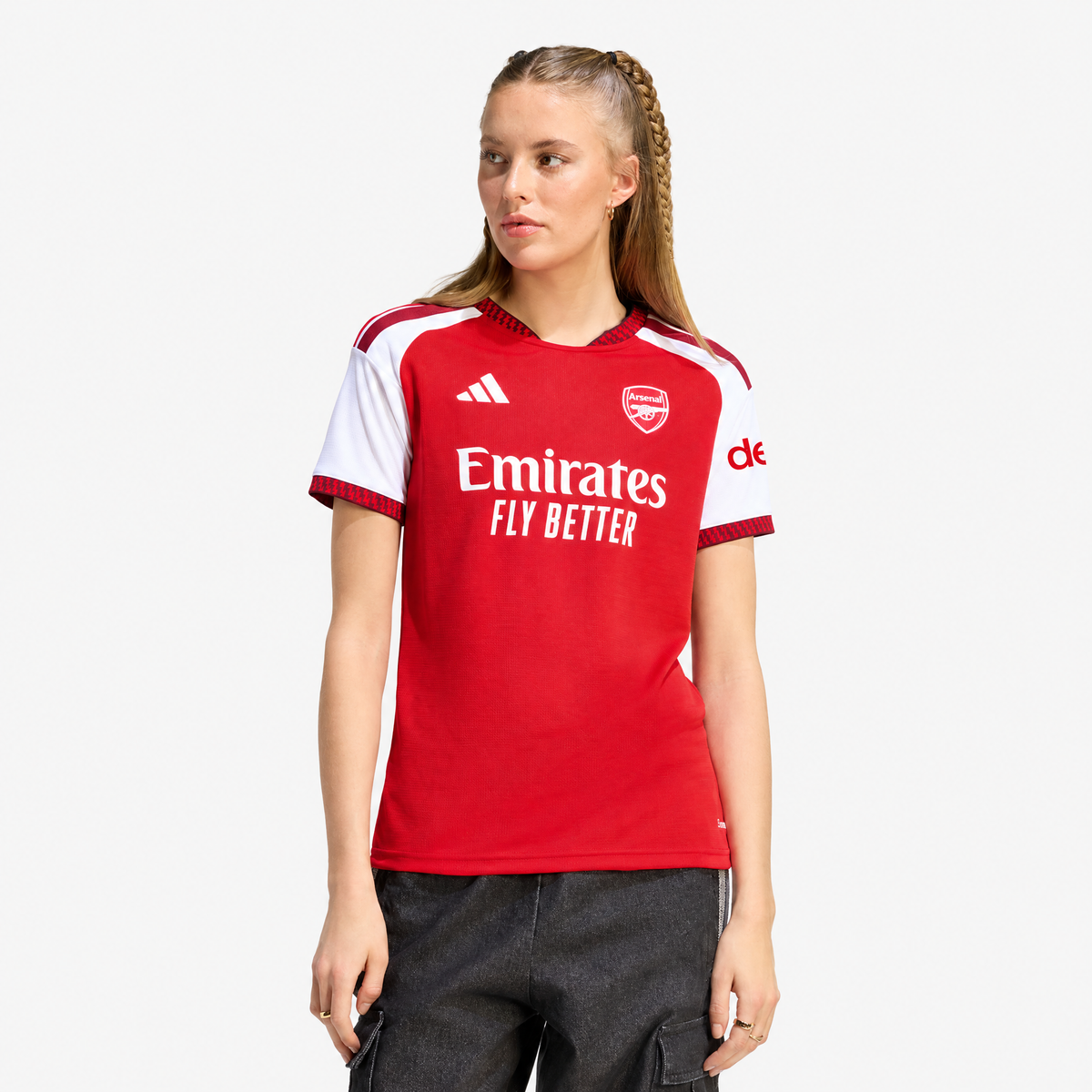 Arsenal 2026/27 Home Women's Jersey - woman wearing the shirt; AI-assisted studio background adaptation