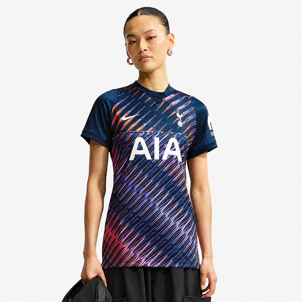 Tottenham Hotspur 2026/27 Away Women's Jersey - woman wearing the shirt; AI-assisted studio background adaptation
