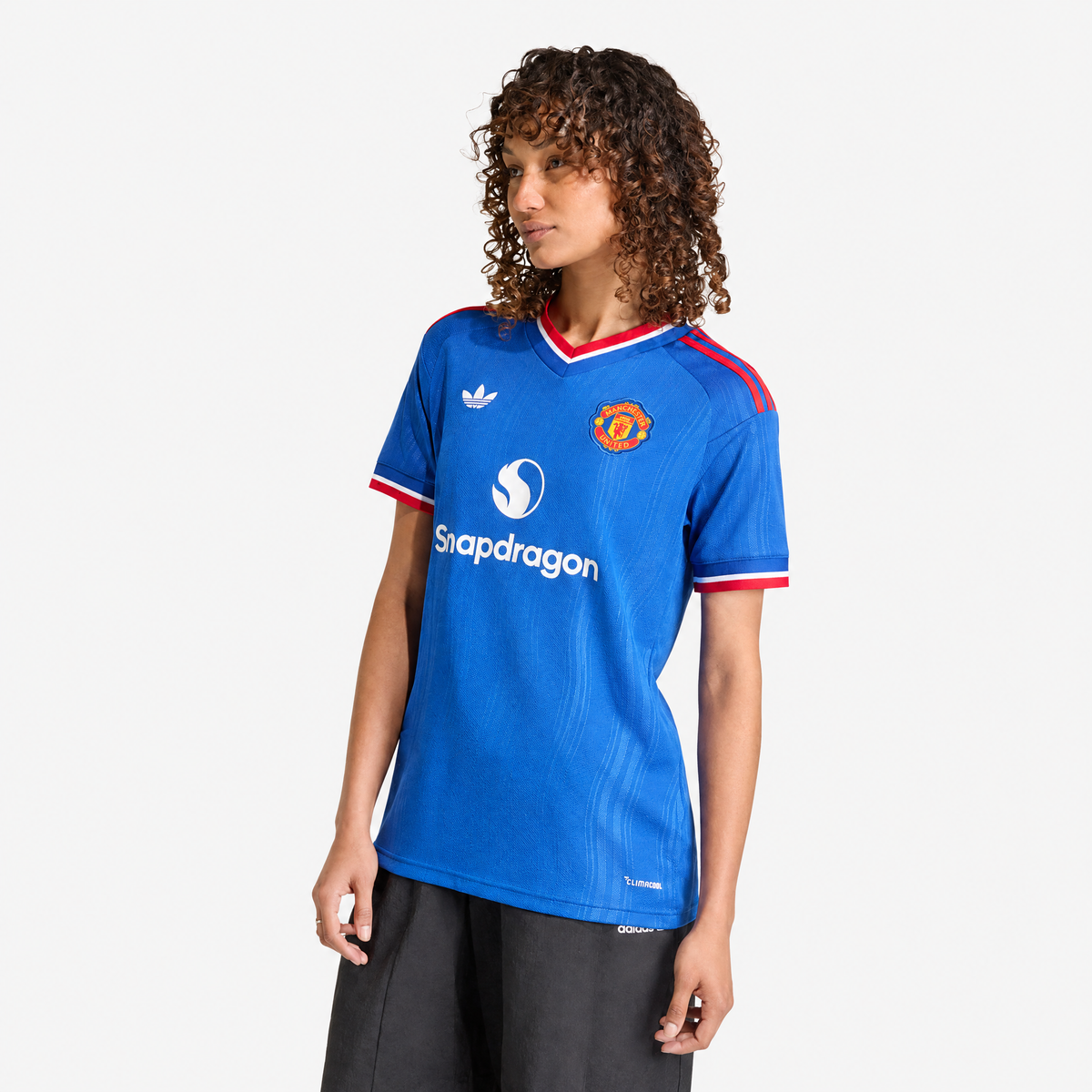 Manchester United 2026/27 Away Women's Jersey - woman wearing the shirt; AI-assisted studio background adaptation