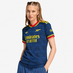 Arsenal 2026/27 Away Women's Jersey - woman wearing the shirt; AI-assisted studio background adaptation
