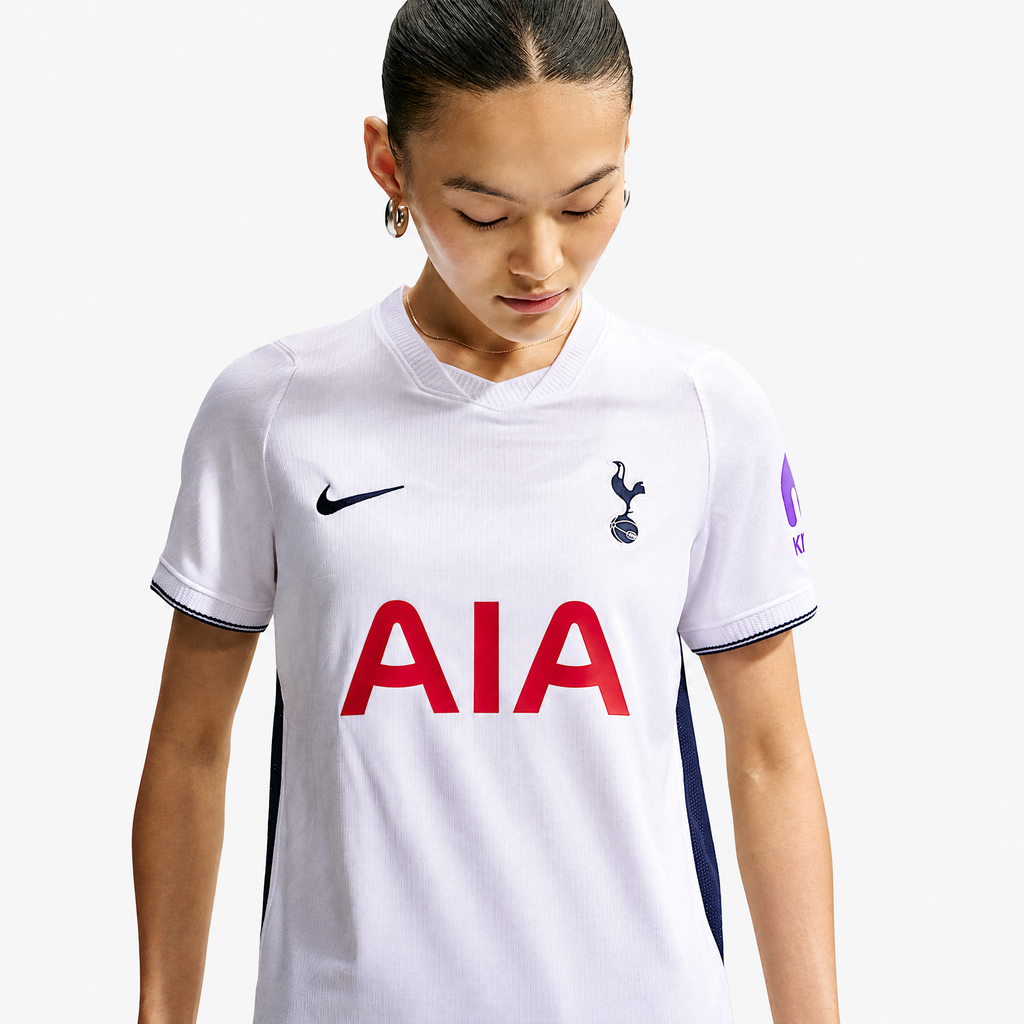 Tottenham Hotspur 2026/27 Home Women's Jersey - woman wearing the shirt; AI-assisted studio background adaptation