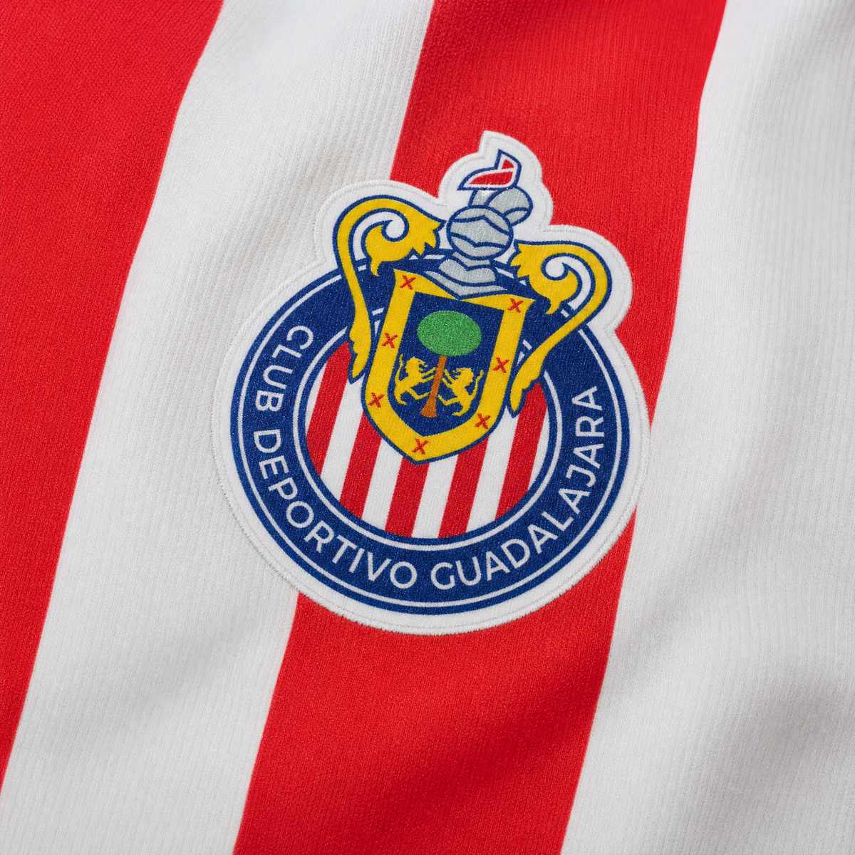 Chivas Guadalajara 2026/27 women home jersey - woven crest and striped chest macro detail