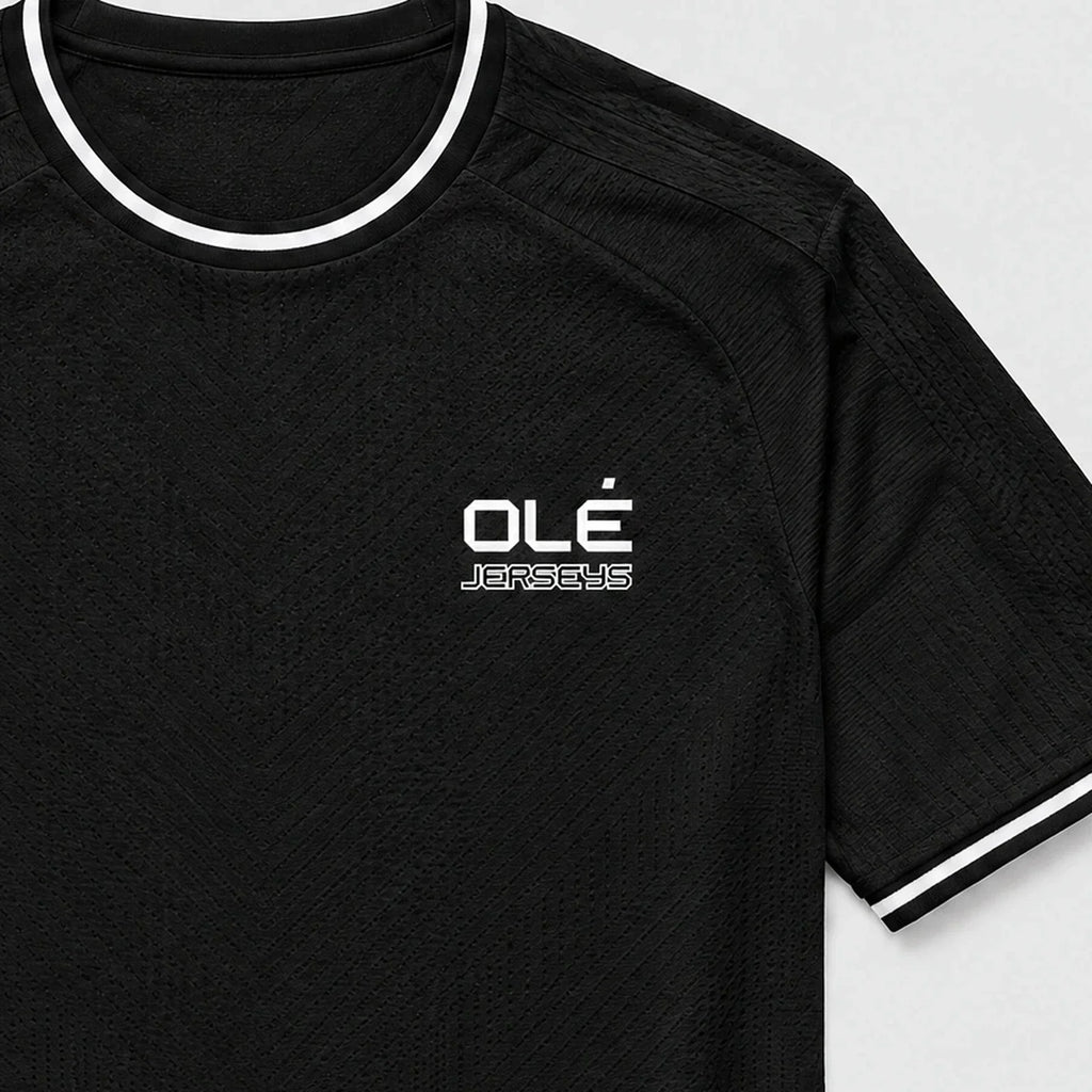 Olé Player Jersey — Black — logo detail