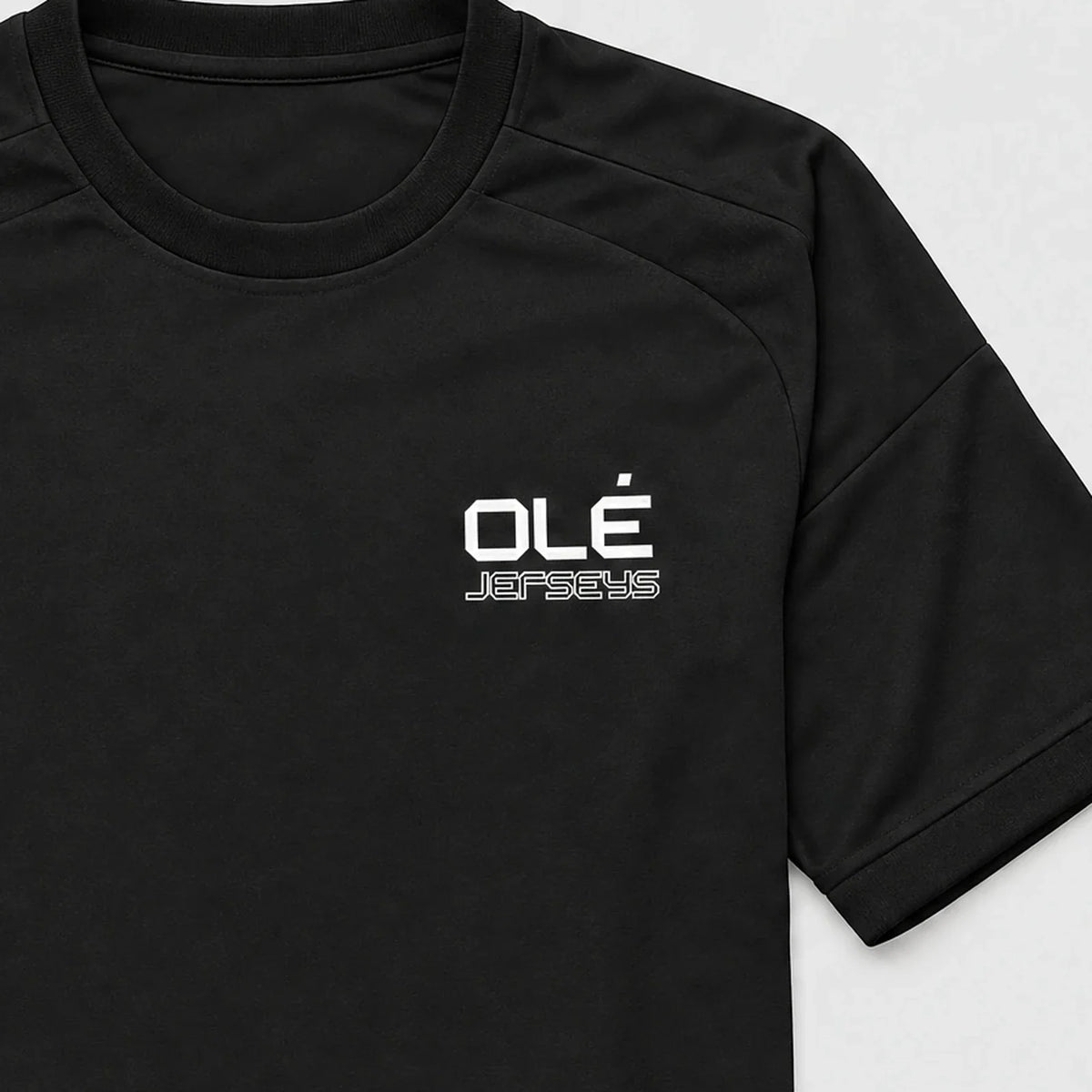 Olé Core Jersey — Black — logo detail
